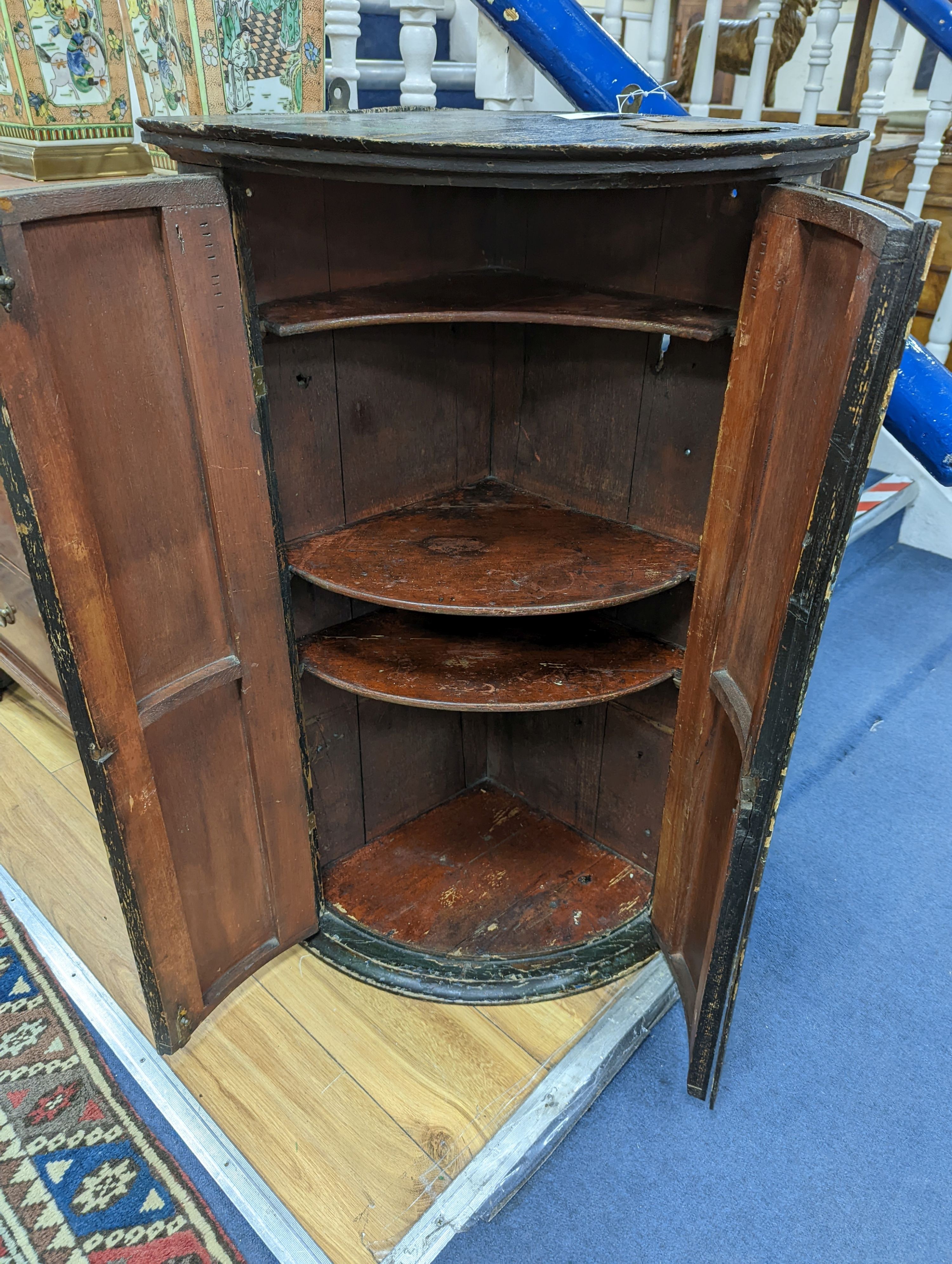 An 18th century Japanned lacquer bow front hanging corner cabinet, width 58cm, depth 39cm, height 92cm